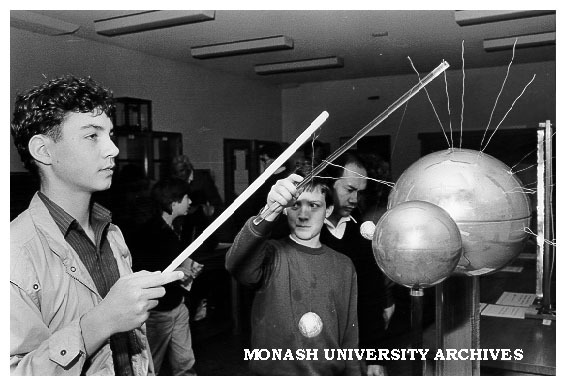 Visitor playing with static electricity from Van Der Graph generator