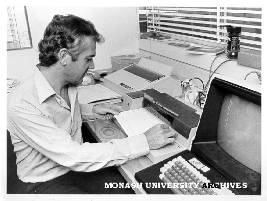 Dr Brian Chapman pulling biomedical simulation printout from plotter