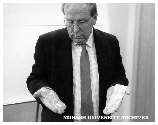 Professor Roger Short displaying condoms of the future