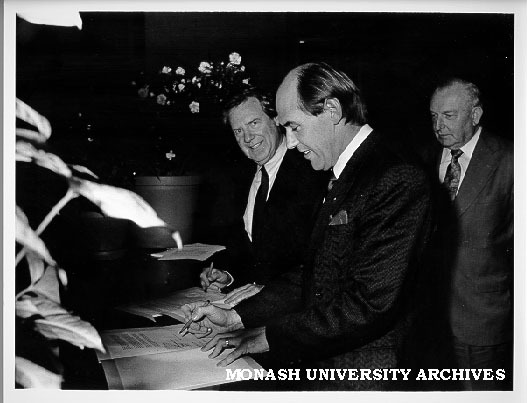 Vice-Chancellor Professor Mal Logan (left) and president of Association of Ukrainians in Victoria signing agreement for teaching and research appointment