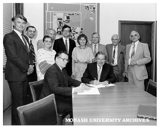 Members of Slavic Languages department and Victorian Ukrainian community at signing of agreement to support lectureship. Mr Stepan Lysenko (seated left) and Vice-Chancellor Professor Ray Martin