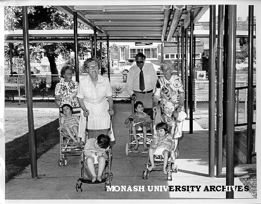 Members of Social Work's foster grandparents group with young people at St Nicholas' Hospital