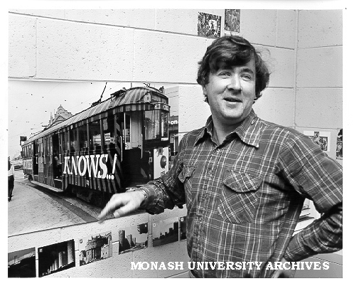Lecturer Dr Conrad Hamann explaining the 'Mother Knows ...!' Melbourne tram