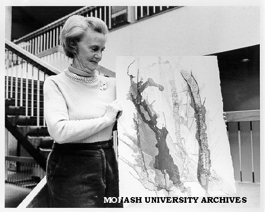 Artist Peggy Perrins Shaw with painting to be displayed in exhibition at Wiregrass Gallery