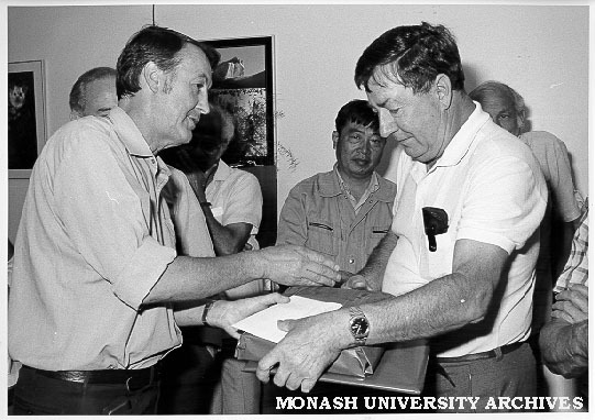 Senior lecturer Ian Hiscock receiving retirement gift from Ian Bayly