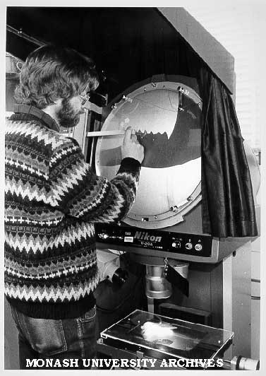 Dr Gordon Sanson measuring magnified profile of lower jaw