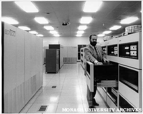 Operations supervisor Brian Potton changing disk pack in B7800 computer