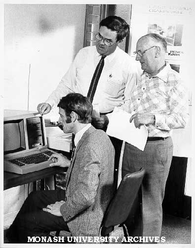 Mr Doug Axnick, design engineer with Shire of Pakenham (seated), Dr Jack McDonell, director of Centre for Continuing Education, and course coordinator Mr James Crockart
