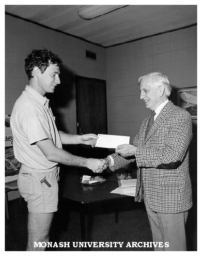 Director Peter Thompson accepting Garnet H. Carroll award from Professor John Legge