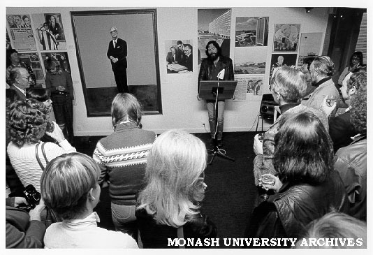 Pete Steedman opening 'Making Monash' exhibition alongside Fred William's portrait of Sir Louis Matheson