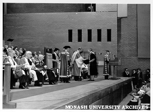 Dr Ernie Nunn receiving 25 year medallion from HRH Prince Philip, Duke of Edinburgh, Silver Jubilee Graduation ceremony
