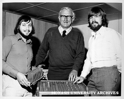 Deputy Warden of Union Doug Ellis inspecting voting console designed by students in computer science, including postgraduate John Rosenberg (left) and tutor Peter Dewildt