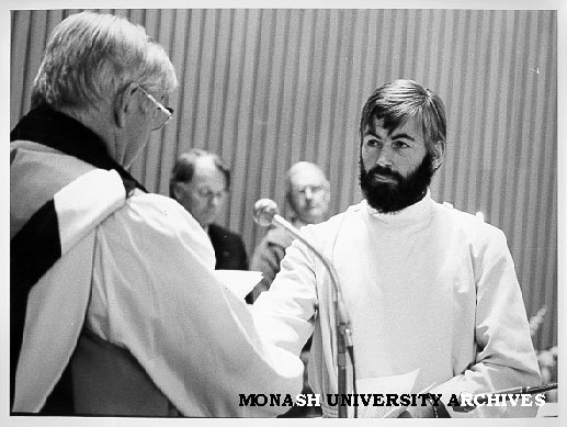 Bishop David Shand (left) commissioning Father Philip Huggins as chaplain to Monash