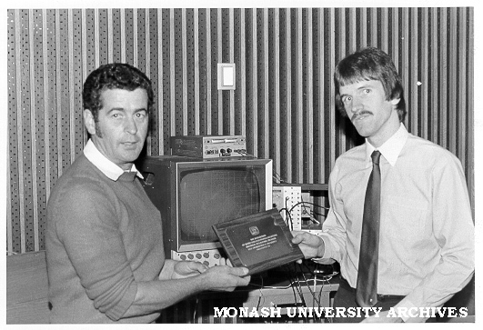 Nick Batten (right) receiving IREE trophy from Dr Barry Harrison, chairman of Melbourne division, for best final year electrical engineering project