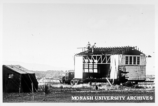 Moving old school house, February 1964