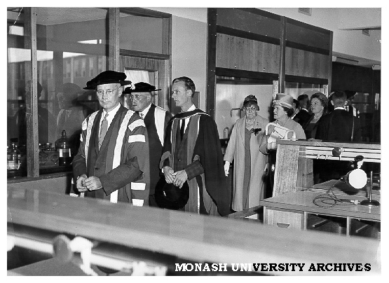 Interim Council Chairman Robert Blackwood, Mr Justice Lowe, Professor Ron Brown and guests touring Science buildings following university's opening ceremony, March 1961