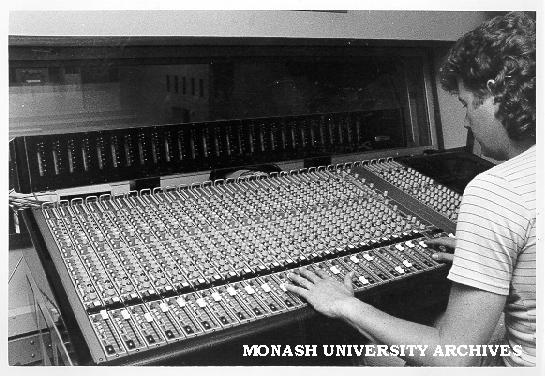 Technician David Marmo operating Harrison MR4 28-channel audio-mixing console