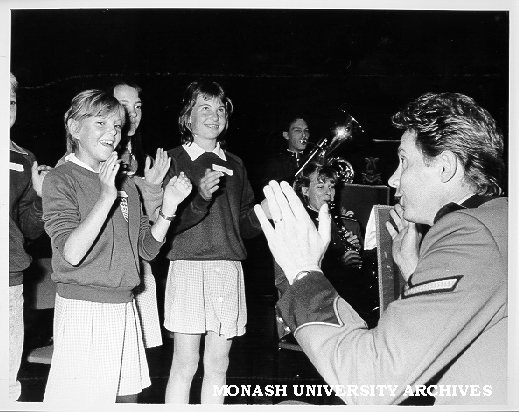 Member of the Third Military District band with local school children