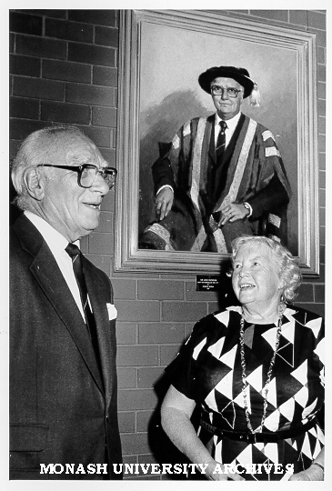 Sir Louis Matheson and Lady Matheson under Patricia Moran portrait commissioned by staff members