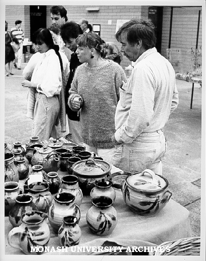 Browsers at pottery stall outside Union building