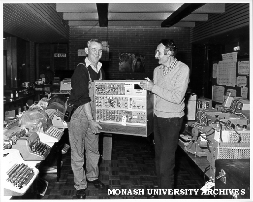 Earl Headland (right) and Tim McNair arranging goods for 'garage sale' of used equipment