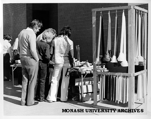 Browsers at candle stall, Friday market