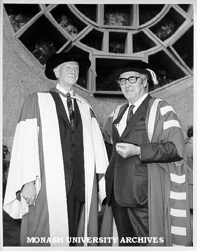 Honorary Doctor of Laws Sir Lindesay Clark with newly installed Chancellor Sir Richard Eggleston, in front of Lindesay Clark window by Leonard French, Robert Blackwood Hall