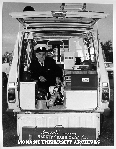 Ron Berry of Central Services inspecting equipment in emergency vehicle