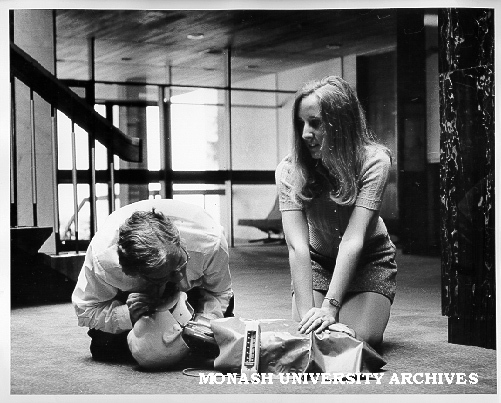 Julie Brown applying heart massage, while Safety Officer Bill Barker performs resuscitation