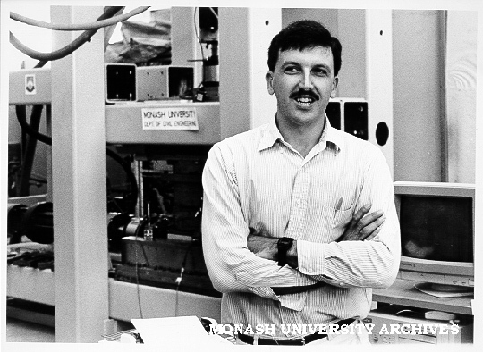 Student Mr Julian Seidel in front of Cyclic Constant Normal Stiffness Direct Shear Machine