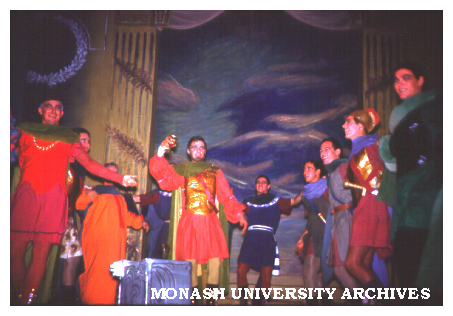 Unidentified stage scene - group of actors in medieval (?) costume