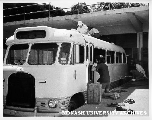 Greg Segal (at door) and John Green (on roof) restoring Union bus