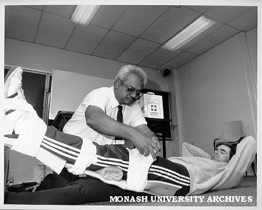 Dr Jayaram from St John's Ambulance demonstrating first aid technique on gardener Paul Mechelen