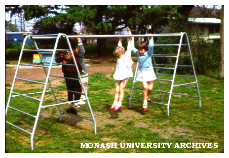 Children playing on climbing bars at Birch Cottage