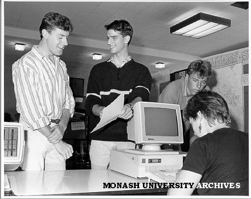 Host Scheme enrolment. Coordinator Harvey Kalman (centre) and volunteer helper Wendy Bainger (seated) enrolling Gregory Young (left) and Peter Smith