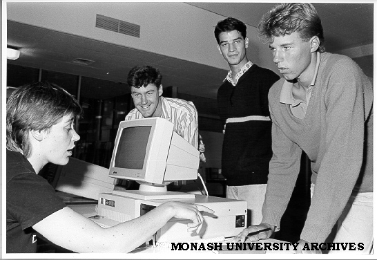 Host Scheme enrolment. Volunteer helper Wendy Bainger (seated) and Coordinator Harvey Kalman (second left) enrolling Peter Smith (right) and Gregory Young