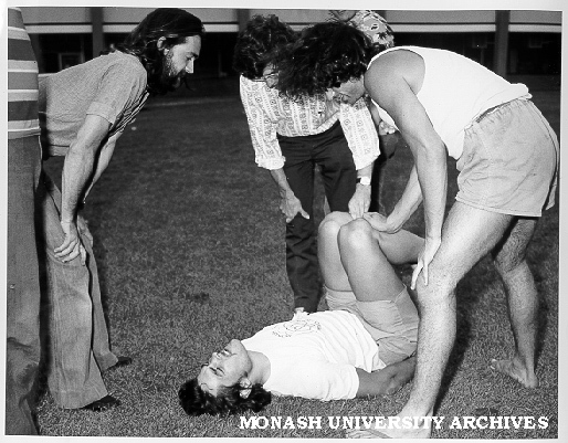 Students, Orientation Week, Ernie Gibbs on ground - superball 'new games' activity