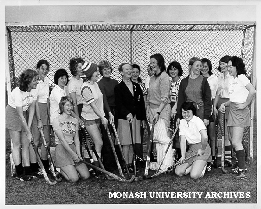Coach Florence Vasey (centre) and Women's hockey team