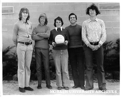 Volleyball team with trophy, from left: Mark Troliniuk, Ray Wilson, Liz Minahan, Steve Trafficante and George Szlawski