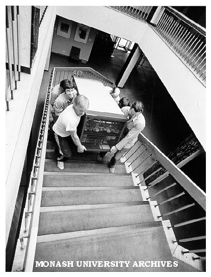 Parts of PABX system being taken up stairs of University Offices