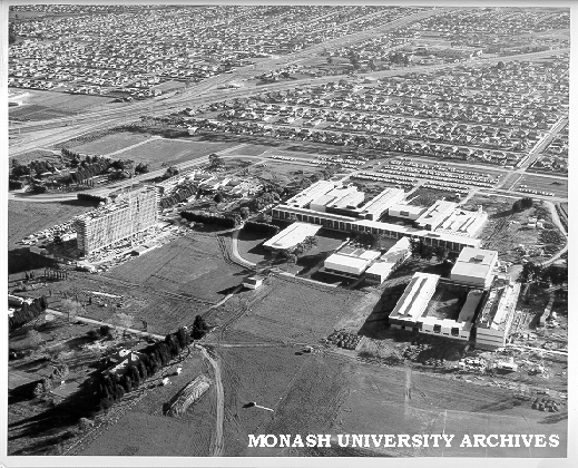 Aerial view of completed Science buildings, 16 July 1962, with Engineering buildings under construction in right foreground and Humanities building to left