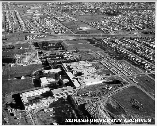 Aerial view of building construction, July 1962, from north, with intersection of Wellington and Dandenong roads in background