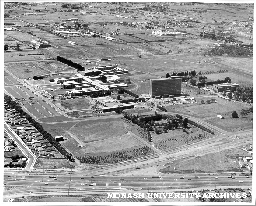 Aerial view of buildings, January 1963, from south west with intersection of Wellington and Dandenong roads in foreground
