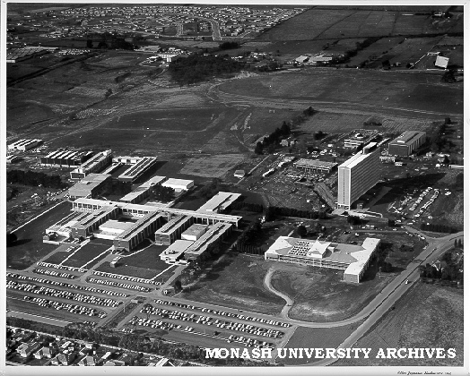 Aerial view of site and buildings, November 1963, from west with car parks in foreground