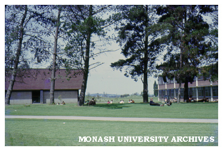 Science area with pine trees and students, January 1965
