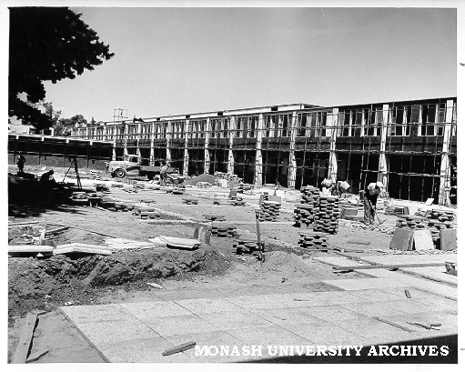 Laying pavers in Science courtyard