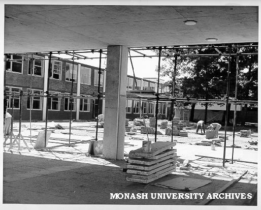 Laying pavers in Science courtyard