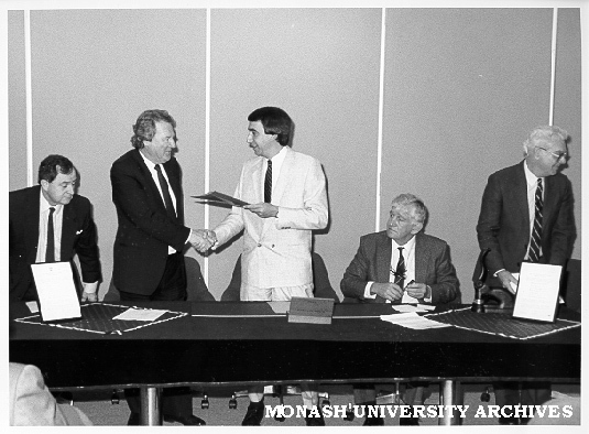 Signing of Heads of Agreement between Monash and Chisholm Institute of Technology, Vice-Chancellor Professor Mal Logan and President of Chisholm Council Mr Paul Ramler shaking hands