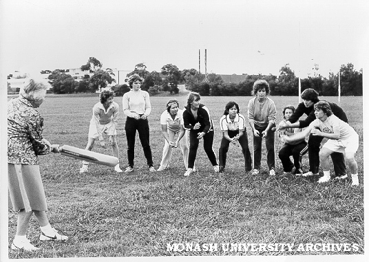 Women's cricket team with coach Lola Cameron