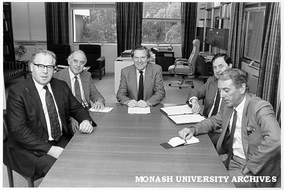 Meeting in Vice-Chancellor's Office. Vice-Chancellor Professor Mal Logan (centre), Sir Peter Swinnerton-Dyer (left, UK University Grants Commission), DVC Professor Ian Polmear, Comptroller Mr Peter Wade, and Registrar Mr Tony Pritchard